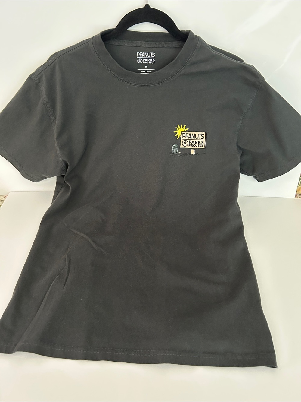 Peanuts Black Graphic Tee with Yellow Sun Detail